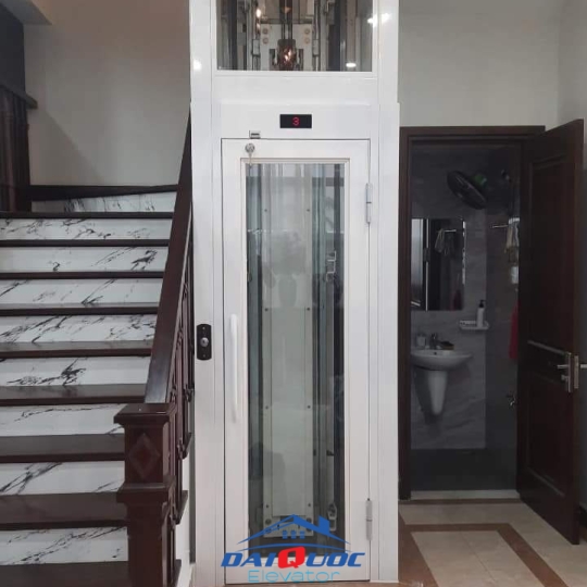 THANG MÁY HOMELIFT LỒNG KÍNH CỬA MỞ TAY